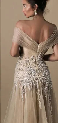 This is a stunning phone live wallpaper featuring images of a woman in a dress with sparkling design