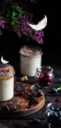 Get lost in the captivating beauty of this phone live wallpaper featuring two jars of tasty food placed on a wooden table