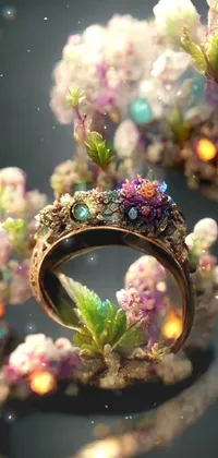 This phone live wallpaper features a close-up of a stunning ring surrounded by delicate flowers against a crystal-filled wall