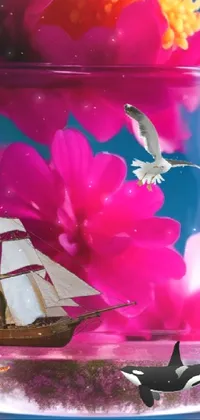 This phone live wallpaper showcases a beautiful vase filled with pink flowers and a sailboat sailing across a calm ocean