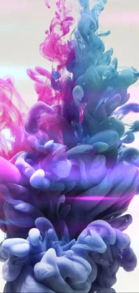 This live wallpaper for your phone displays a stunning close-up of colored ink swirling in water