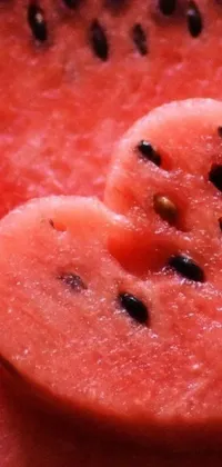 This stunning phone live wallpaper features a close-up of a slice of watermelon, with heart-shaped seeds adding an enchanting touch