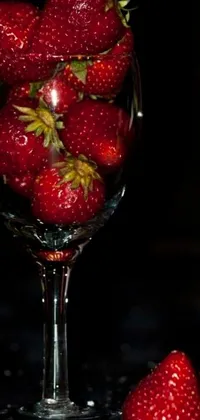This 3D live wallpaper showcases a luscious glass brimming with strawberries, overflowing with juice that spills out onto the table