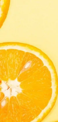 Enjoy a juicy burst of citrus on your phone with this live wallpaper featuring sweet orange slices stacked on a sunny yellow background