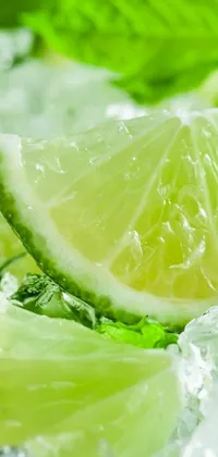 This live wallpaper showcases a high-quality, close-up photo of lime slices artfully arranged over ice in a glass
