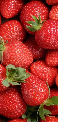 This stunning phone live wallpaper features a close-up shot of ripe, delicious strawberries