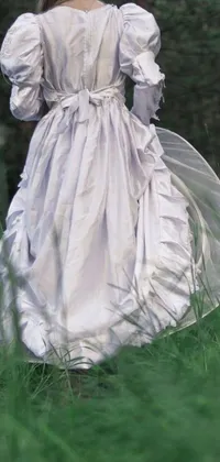 This stunning live wallpaper showcases a woman walking through a green meadow in an exquisite 1840s-style wedding dress