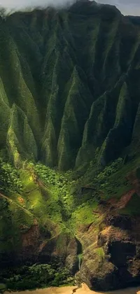 This live wallpaper for your phone displays a peaceful body of water alongside a vibrant green mountain