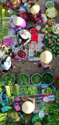 This lively phone wallpaper displays an array of colorful vegetables atop a table, accompanied by a photo, drone footage, and a Vietnamese woman