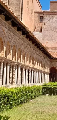 This phone live wallpaper features a peaceful courtyard with a Romanesque architecture style