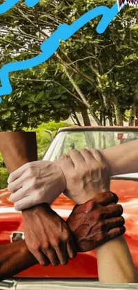 This phone live wallpaper captures the essence of realism with its image of a group of people holding hands in front of a car in a Cuban setting