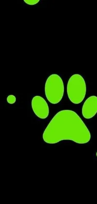 This phone live wallpaper features a green paw print on a black background with hot neon green ornaments, a cat tail, and a dog pawprint that appears on touch