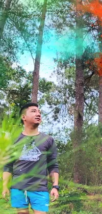 This energetic phone live wallpaper showcases a man in a colorful forest with a frisbee