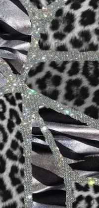 This stunning phone live wallpaper showcases a black and white feather mosaic design with crystal cubism influence