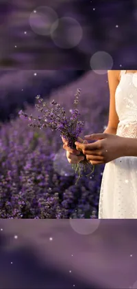 This phone live wallpaper showcases a charming woman holding a bouquet of blooming flowers in a white dress, set against a lavender field