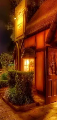 This phone live wallpaper showcases a charming night time scene of a restaurant entrance glowing in warm lights