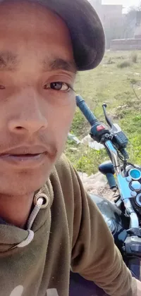 This live wallpaper features a close-up of a motorcyclist resting his arm on the bike's handlebars
