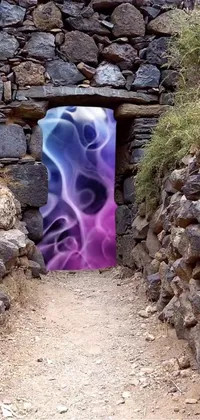 This phone live wallpaper features psychedelic digital art of a door on a stone wall with purple fire, creating a surreal and dreamlike atmosphere