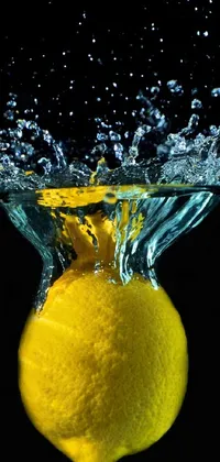 This phone live wallpaper features an eye-catching underwater photograph of a lemon, captured from below by Paul Emmert