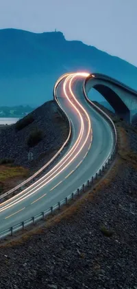 This live wallpaper showcases a stunning long-exposure photo of a highway on a bridge in Norway