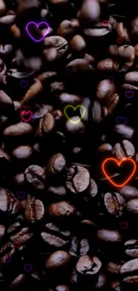 This live wallpaper features a close-up of coffee beans rendered digitally, with a graffiti-inspired background and gothic, VHS-style hearts adding edginess