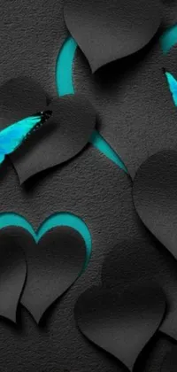 Enhance your mobile device with this stunning live wallpaper featuring a majestic blue butterfly perched atop a black paper heart background