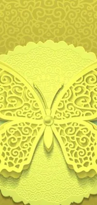 This mobile live wallpaper features a stunning paper cut-out of a butterfly, designed in intricate art nouveau style