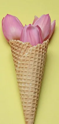 This lively phone wallpaper showcases a fun and playful scene, featuring a colorful arrangement of pink tulips arranged inside an ice cream cone with a textured blue waffle cone
