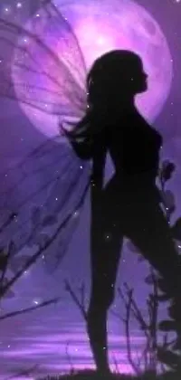 This exquisite phone live wallpaper presents a fairy standing silhouetted against a full moon in purple hues