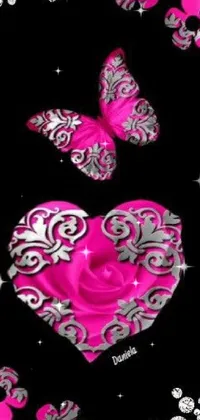 This live wallpaper features a stunning pink heart surrounded by charming butterflies on a black background, accompanied by delicate pink roses