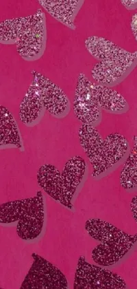 Looking for a stunning and eye-catching phone live wallpaper? Check out this glitter heart design featuring a close-up of shimmering hearts on a vibrant pink background