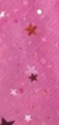 This live phone wallpaper showcases a vibrant pink fabric featuring white stars that add a magical touch