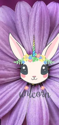 This phone live wallpaper features a stunningly captured close-up of a delicate flower hosting a friendly bunny