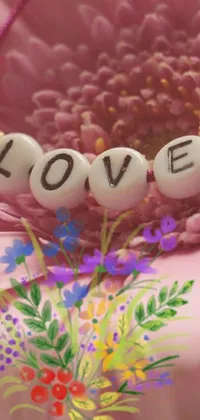 Decorate your phone screen with a charming pink flower live wallpaper! The center of the screen features a beautiful pink flower with the word "love" spelled out in elegant cursive letters on top