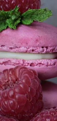 This live wallpaper showcases a stunning image of colorful raspberry macarons, beautifully stacked on top of each other