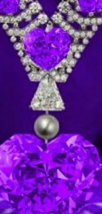 This phone live wallpaper showcases a purple heart-shaped diamond necklace on a vibrant purple background, giving your phone an elegant look