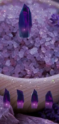 This live wallpaper depicts a wooden bowl filled with abundant purple crystals that shimmer beautifully