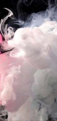 This phone live wallpaper features a mesmerizing pink and white smoke swirl, created using digital art techniques