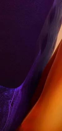 This phone live wallpaper features two cozy pillows set against a background of orange and purple electricity in a macro up-view metallic shot