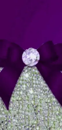 This live wallpaper for your phone features a stunning close-up of a beautifully tied bow on a rich purple background