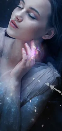 This live phone wallpaper features a digital art image of a woman holding a flower