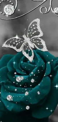 This phone live wallpaper shows a beautiful flower with a butterfly perched on its petals against a teal-colored cloth background with a sparkling glitter GIF effect