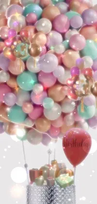 Transform your phone screen with a vibrant live wallpaper featuring a bunch of colorful balloons floating in the air