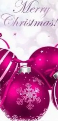 This festive live wallpaper features a group of colorful Christmas balls sitting on top of a snow-covered ground