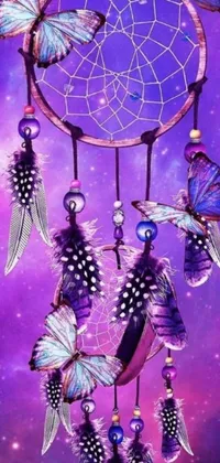 This phone live wallpaper displays a captivating dream catcher embellished with butterflies set against a backdrop of a vibrant purple nebula