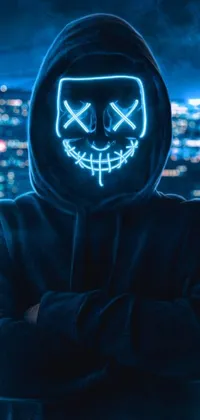 Looking for a unique wallpaper design? Check out this cyberpunk-inspired live wallpaper that showcases a mysterious figure wearing a black hoodie and neon blue mask