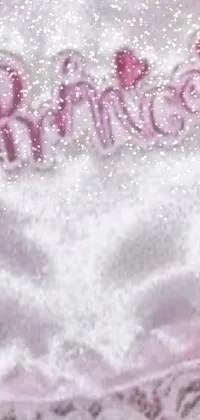 This charming live wallpaper features a close-up of a pink robe with "princess" embroidered on it