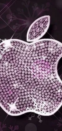 This purple live wallpaper features an enchanting apple logo with snowflakes and pink diamonds set against a fuchsia skin with neon accents
