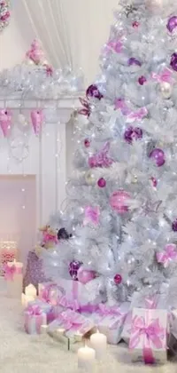This live wallpaper depicts a charming white Christmas tree adorned with vibrant pink and purple decorations