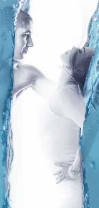 This live wallpaper is a stunning depiction of a man and woman in the water, frozen in time and surrounded by a beautiful poster made entirely of ice
